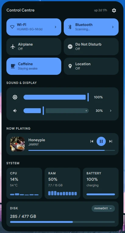 The Lucid control centre: quick setting tiles, brightness and volume, now playing, and CPU, memory, battery and disk